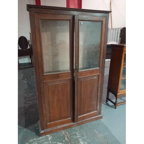 564 - A pine glass fronted cupboard