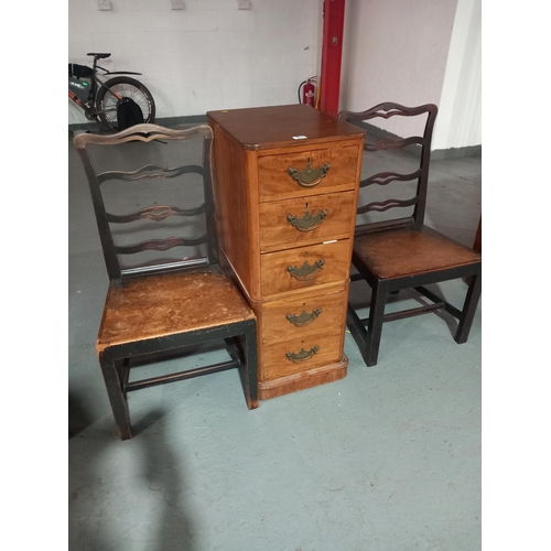 571 - A chest of drawers and two dining chairs