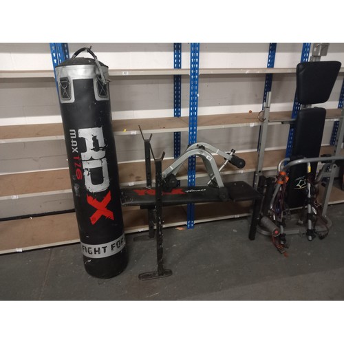 426 - Two weight benches, bike rack and a punch bag