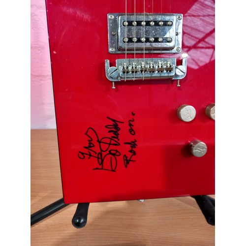 12 - A Gretsch Bo Diddley autographed by Bo Diddley - the autograph reads 