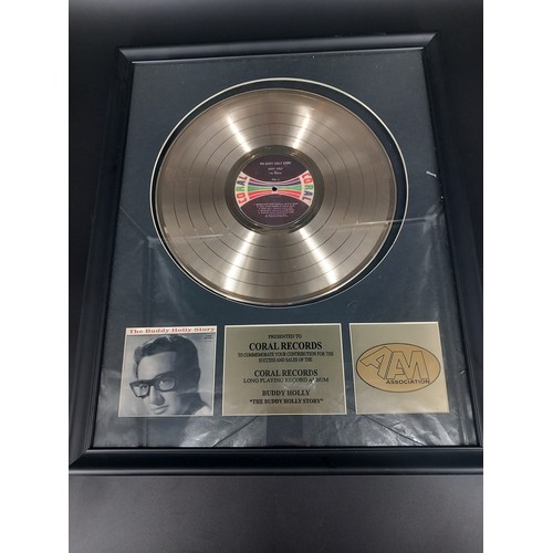 126 - A framed Buddy Holly gold record award - an A.A.M Association certified gold LP award presented to C... 