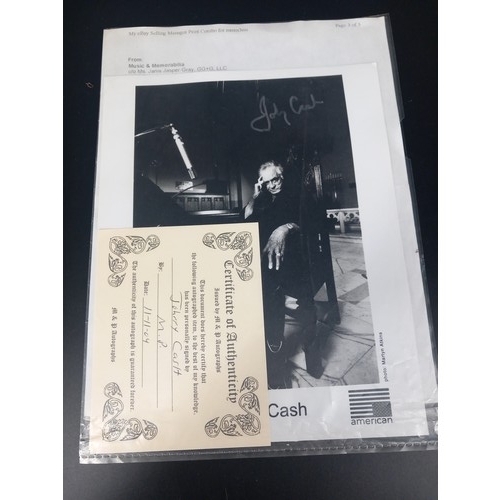 130 - An album card hand signed by Johnny Cash with certificate of authenticity