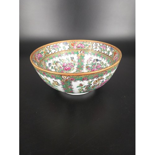 225 - A large famille rose punch bowl - decorated with flowers, butterflies, birds and foliage stunning bo... 