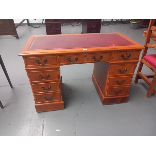 117 - A twin pedestal desk with leatherette insert