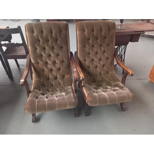 119 - Two upholstered button back and seat armchairs