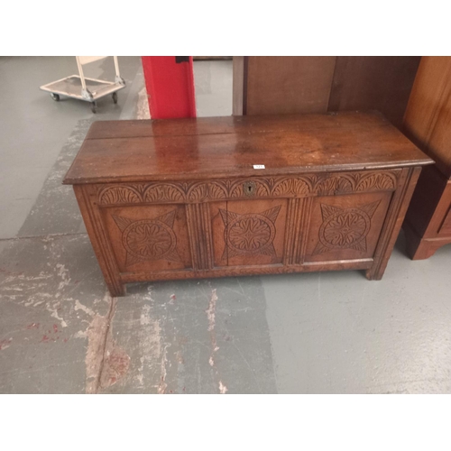 121 - An oak carved fronted blanket box