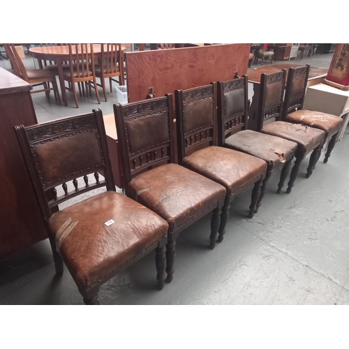 132 - Six oak framed leatherette upholstered dining chairs