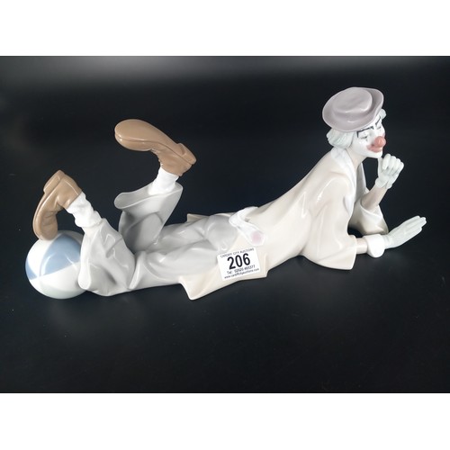 206 - A large Lladro 04618 clown figurine reclining clown with beach ball original box present 37cm long