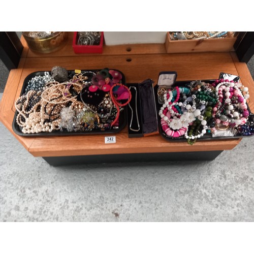 242 - One shelf of costume jewellery - beads, rings etc