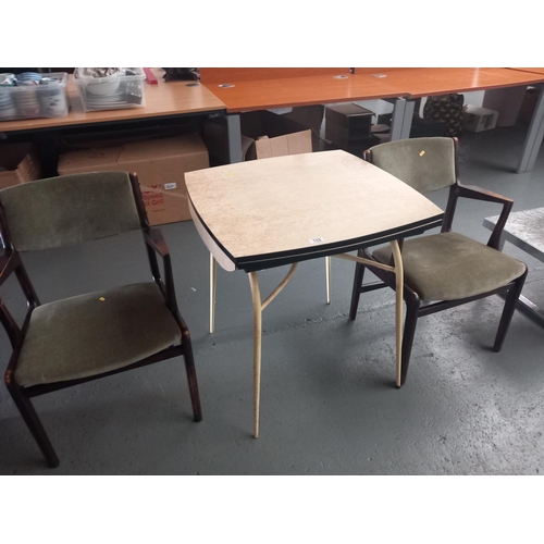 102 - A formica top drop leaf dining table and two chairs