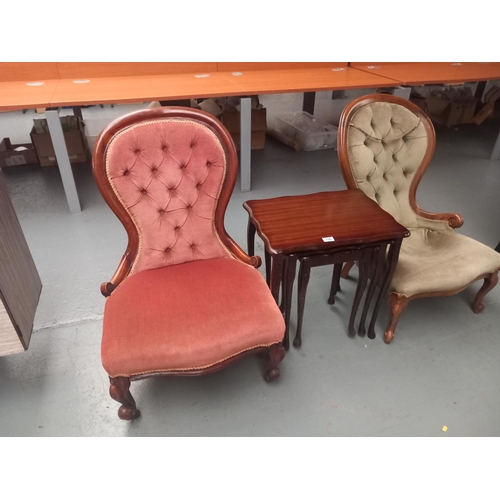 106 - Two upholstered Victorian nursing chairs together with a nest of tables