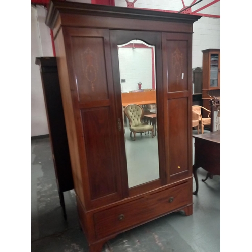 117 - A mahogany inlaid mirrored door wardrobe