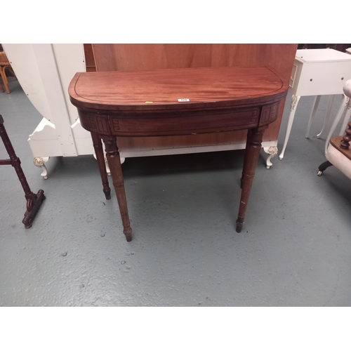 120 - A mahogany fold over card table