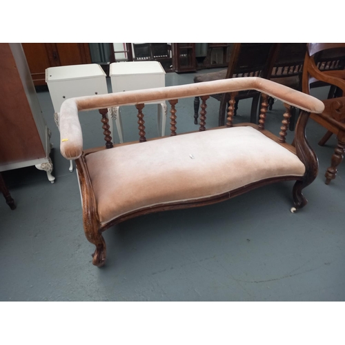 121 - A wood framed two seater sofa wth bobbin turned supports