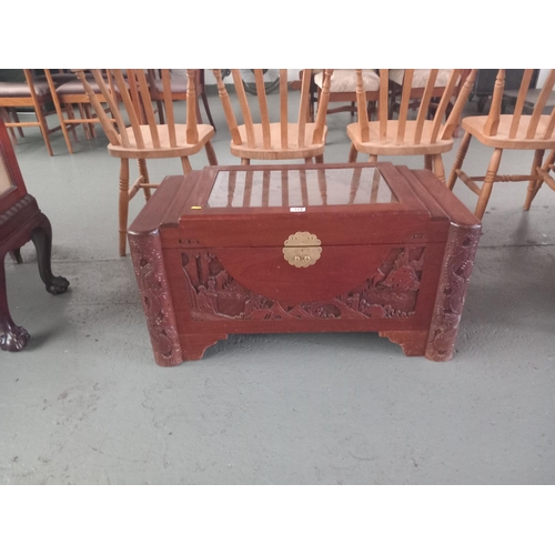 124 - A camphor wood chest with glass top