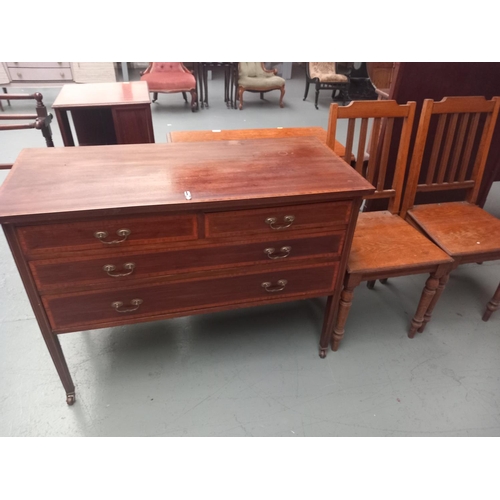 130 - A mahogany two over two chest of drawers together with two oak hall chairs