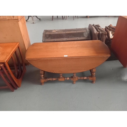 133 - An ercol drop leaf coffee table