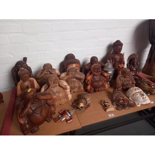 17 - A large collection of asian figures to include buddhas, ganesh etc