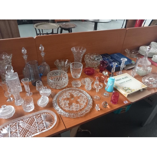 47 - A selection of mostly cut glass decanters, vases, bowls etc
