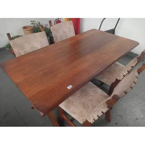 142 - An oak plank top dining table and four chairs