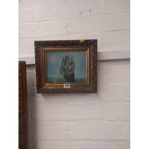 145 - A framed oil on canvas of a ship