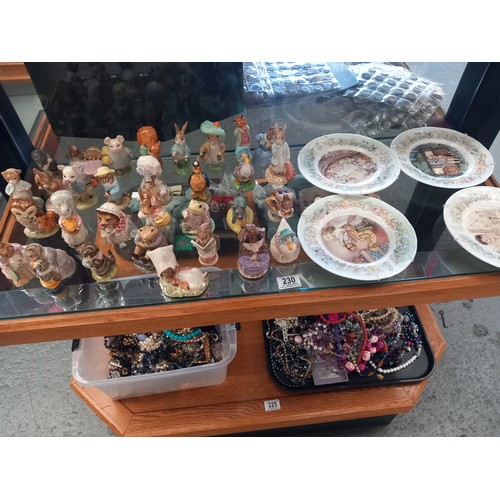 230 - A collection of 31 Royal Albert and Beswick Beatrix Potter figures and four Royal Worcester Peter Pa... 