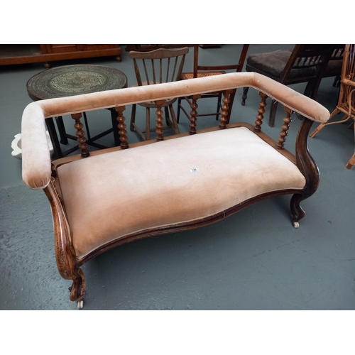 120 - A wood framed two seater sofa wth bobbin turned supports