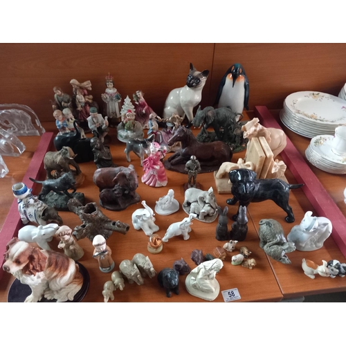 58 - A collection of ornaments to include dogs, elephants, figurines etc