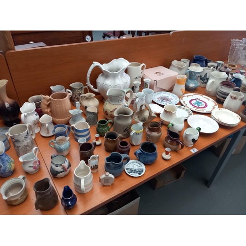 61 - Decorative china to include milk jugs, collectable plates etc