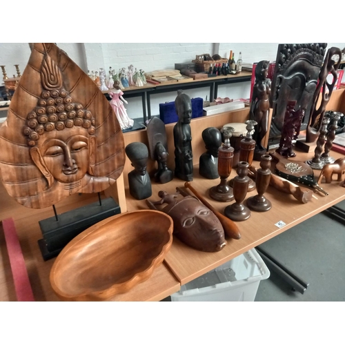 45 - A selection of african carvings, wooden candlesticks etc
