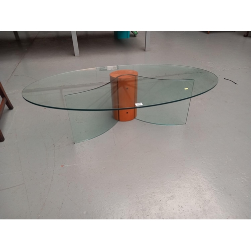 120 - An oval glass top coffee table