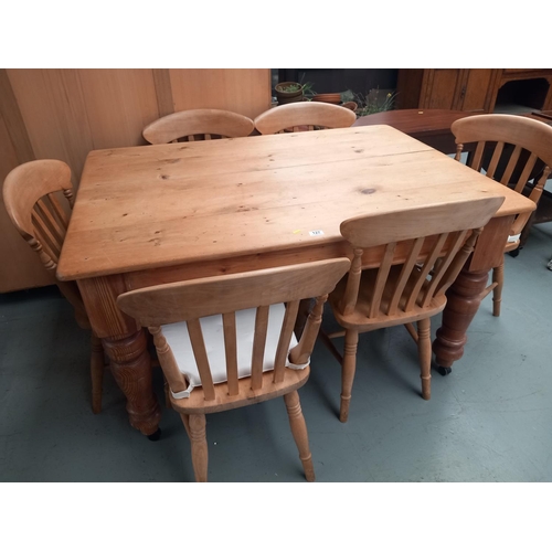 127 - A pine dining table and six chairs