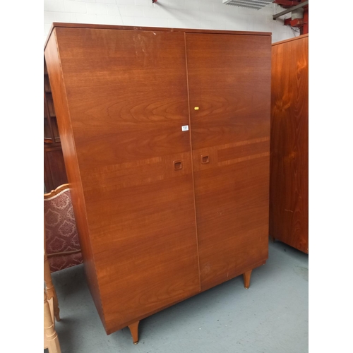 131 - A teak Stonehill double wardrobe