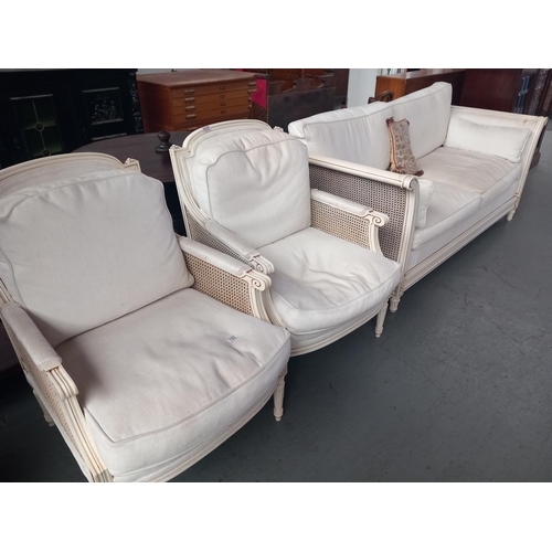 133 - A painted white upholstered two seater sofa and two armchairs