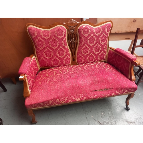 139 - An upholstered two seater sofa