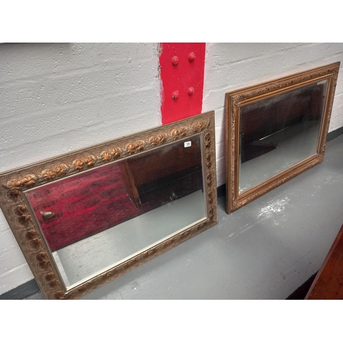 180 - Two large framed bevel edged mirrors