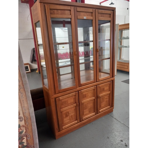 123 - A two section glass fronted bookcase