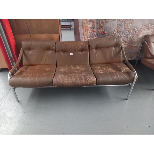 124 - A Pieff chrome frame three seater sofa