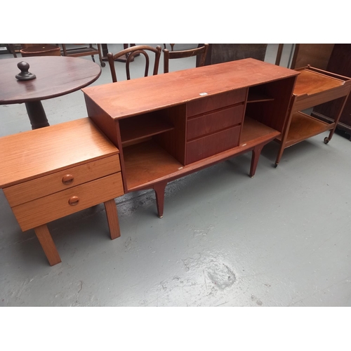 129 - A teak sideboard, drinks trolley and bedside cabinet