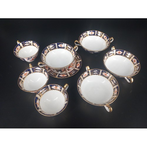 201 - Four Royal Crown Derby 2451 cream soup bowls, three cups and a side plate all in perfect condition a... 