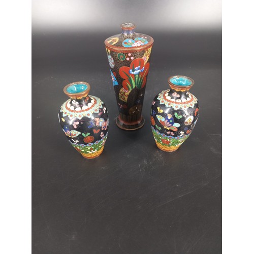 206 - A pair of small early cloisonne vases (9cm tall) both with enamel loss and a taller vase (14cm tall)... 