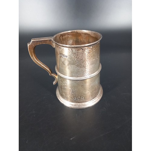 202 - A hallmarked silver beer tankard (12cm tall) hallmarks for Sheffield Charles William Fletcher and So... 