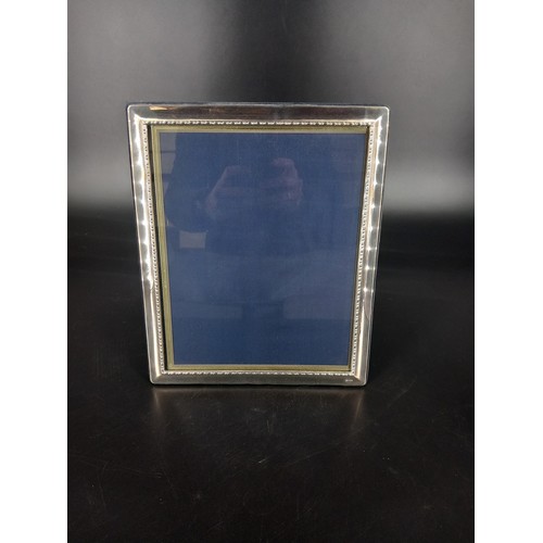 208 - A large hallmarked silver picture frame glass size 25x20cm