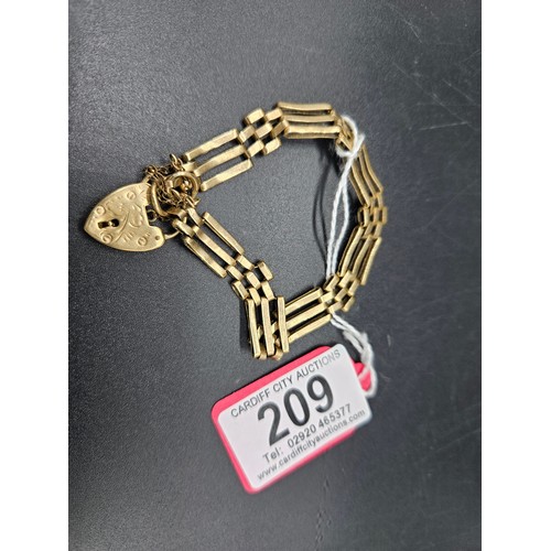 209 - A 9k gold 3 bar gate bracelet - weight 12.2 grams