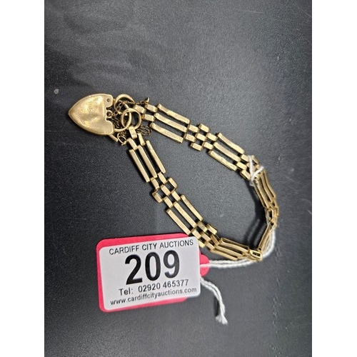 209 - A 9k gold 3 bar gate bracelet - weight 12.2 grams