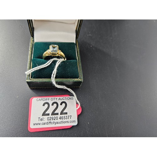 222 - An 18k gold and aquamarine single stone ladies dress ring - weight including stone is 4.8 grams