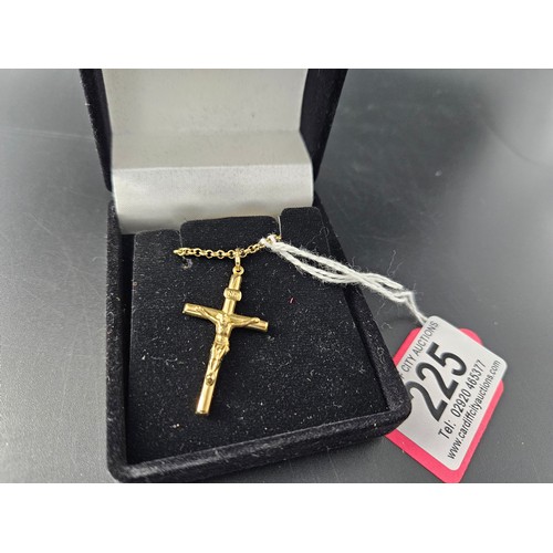 225 - A 9k gold crucifix on a 9k gold chain - combined weight 7.2 grams