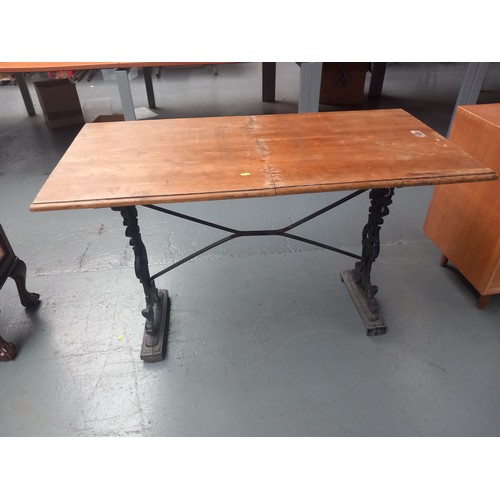 107 - A cast iron base garden table