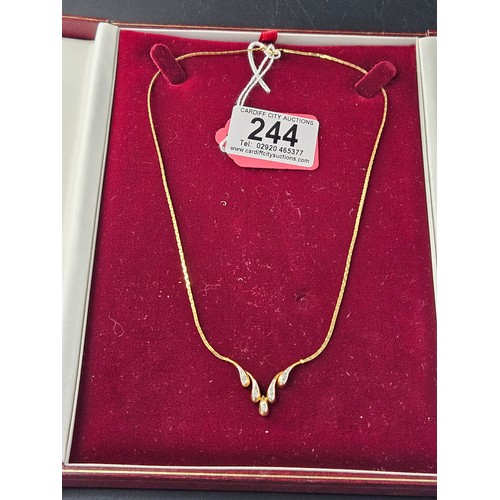 244 - A 9k gold and diamond necklace - weight including stones 4.5 grams