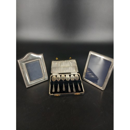 259 - Two small hallmarked silver picture frames and a boxed set of six hallmarked silver teaspoons